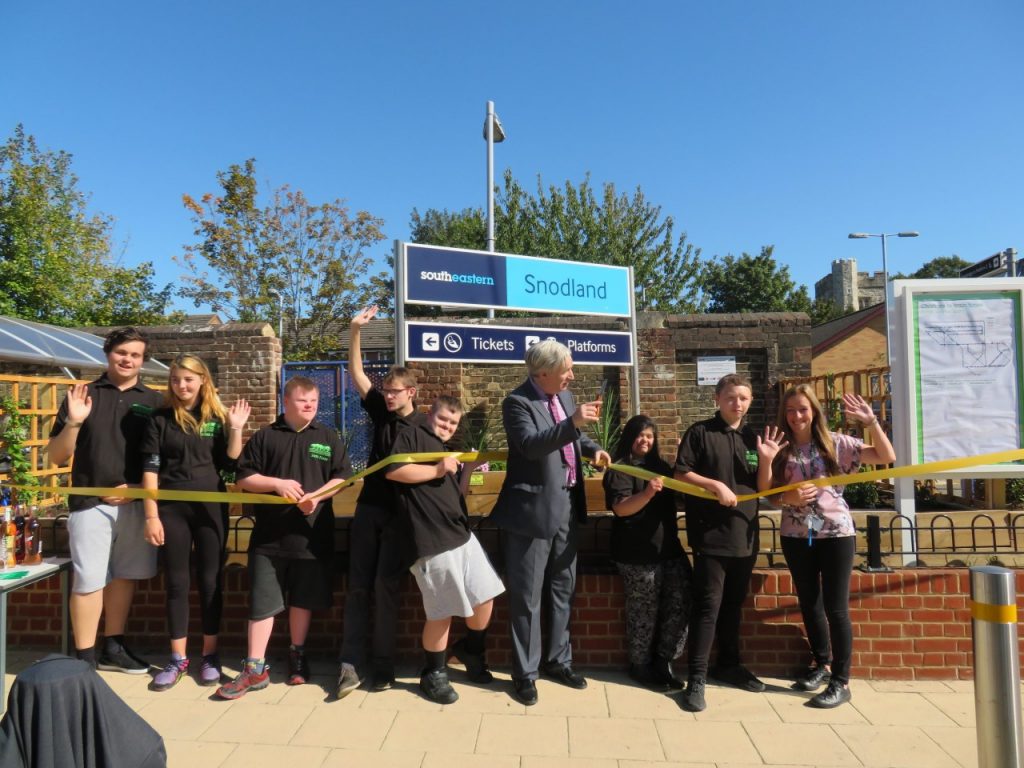 Volunteers from Grow19 celebrate the opening of Snodland station garden