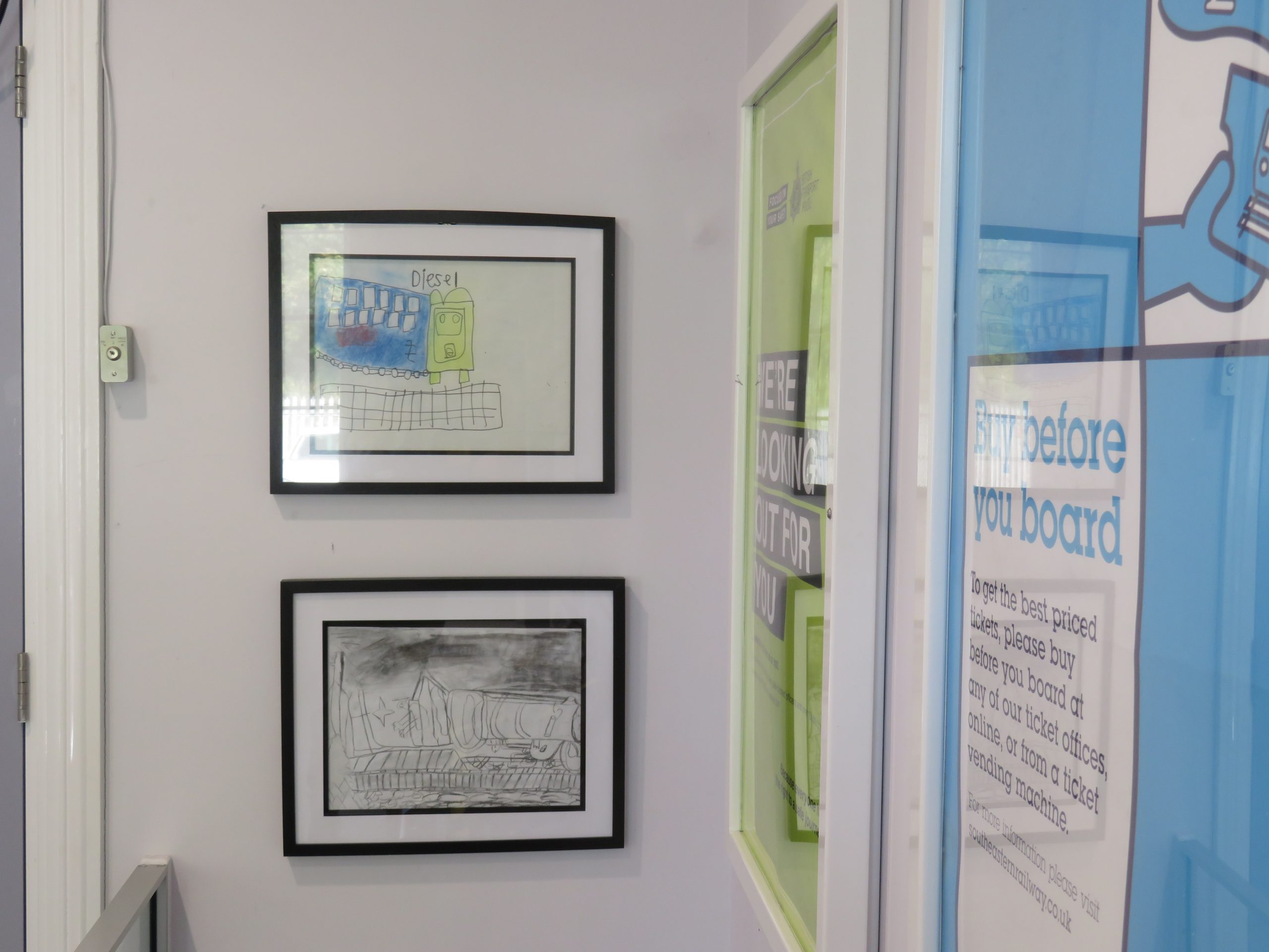 Childrens drawings mounted in frames