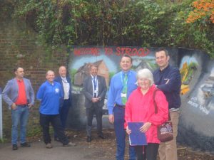 Members gathered outside of Strood station mural