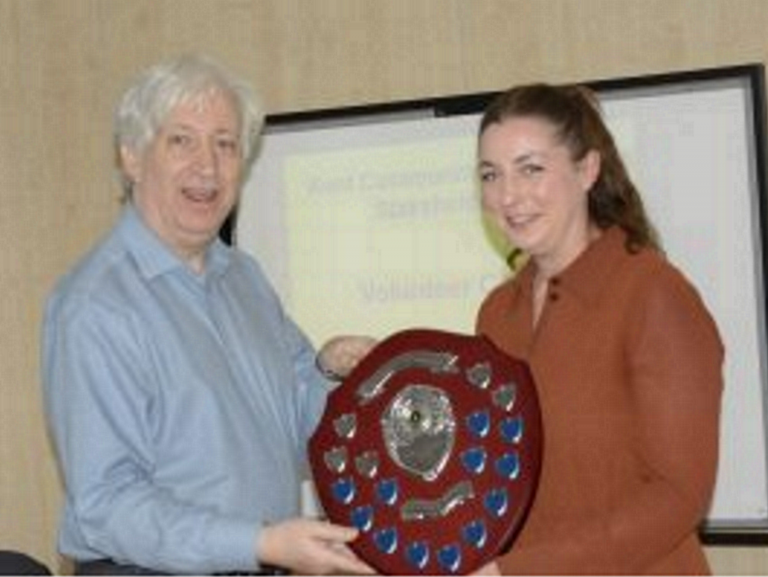 Maria Domican Volunteer of the Year 2021-22 receiving her award from Kent CRP Chair Chris Fribbins