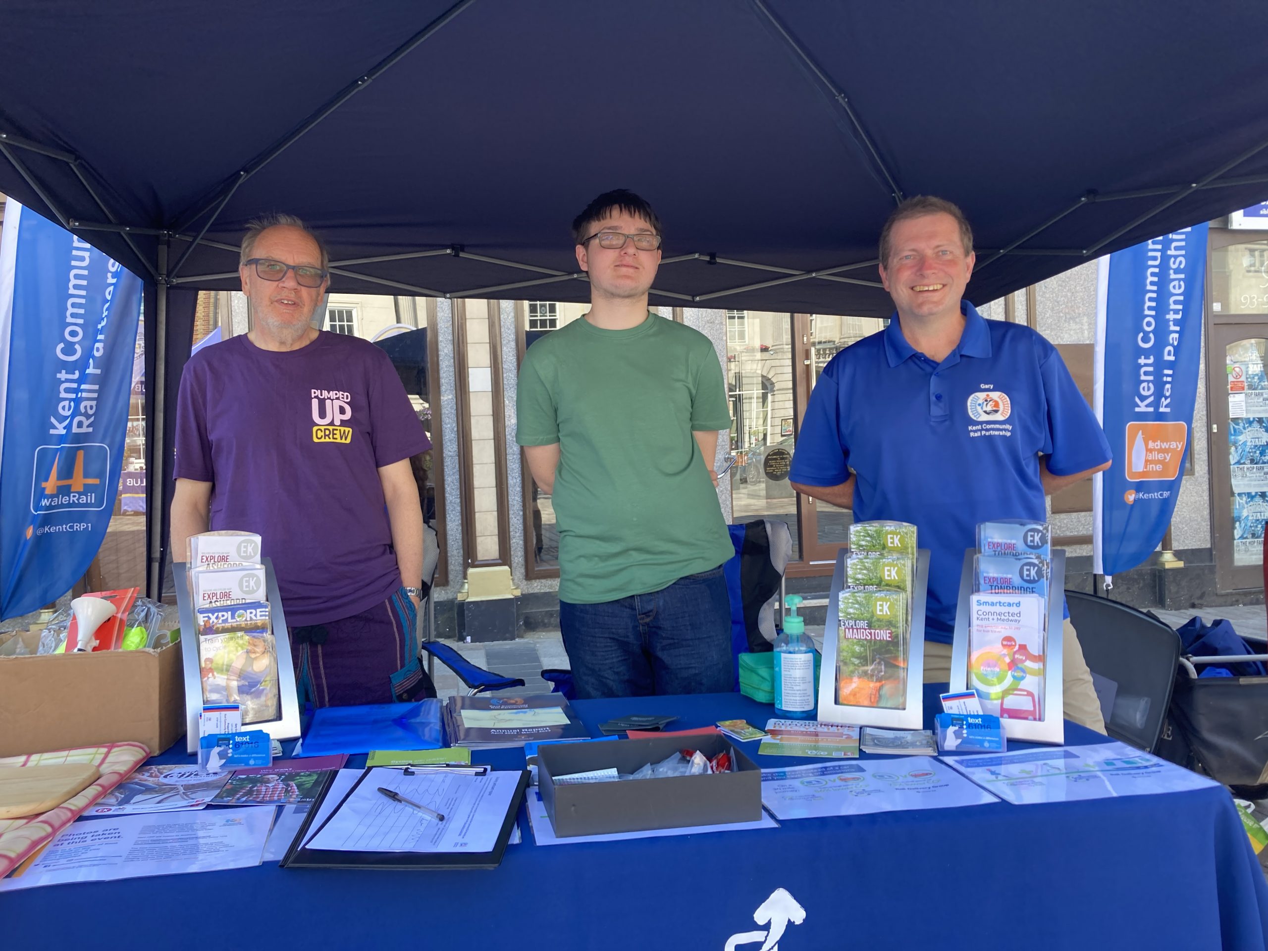 Chris, Dominic and Gary at under the gazebo our stall. There is an array of brochures about where to cycle in Kent.