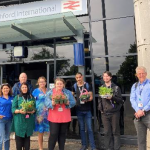 Therese and Matt with a group of students and tutors outside the entrance to Ashford International station