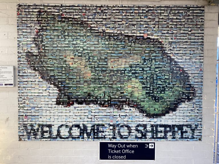 "Welcome to Sheppey" A mural made of numerous smaller images depicting a relief map of the Isle of Sheppey