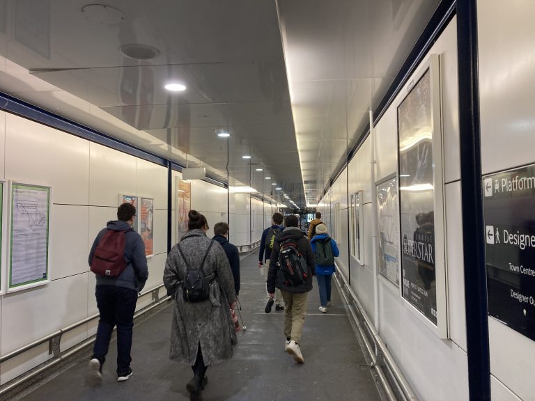 Students, tutors and Therese make their way through Ashford International station.