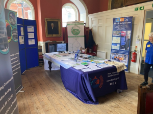 The Mayor's Parlour at Favesham Guildhall with a variety of promotional displays from Rail Future and Kent Community Rail Partnership. Linda is entering the room.