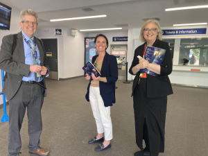 Matt and two tutors in the bright, well-lit booking office at Maidstone East station