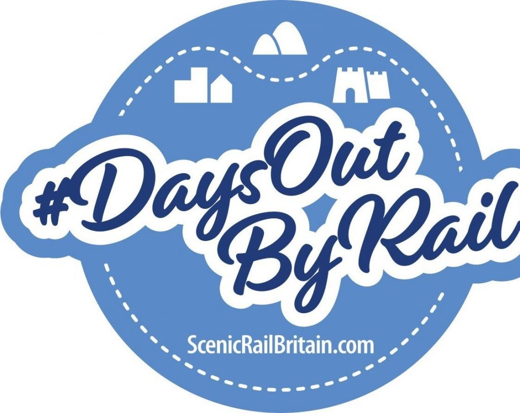 Infographic. A blue circle with the hash tag "Days Our By Rail" and the website of ScenicRailBritain.com Images of a town, hills and a castle appear in the top section of the circle
