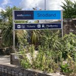 Nettles and weeds in an overgrown garden area at Snodland station.