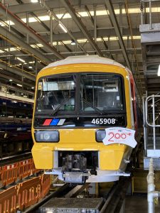 Front view of Networker 465908, Chris Green OBE sporting a Railway 200 service plate.
