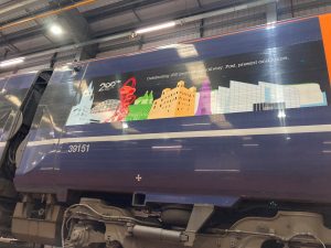 Close up of Javelin unit 39151, showing Railway 200 celebratory vinyls. Images of St Pancras station, the ArcelorMittal Orbit tower, Kentish Oast houses, Rochester Cathedral, Folkestone harbour arm lighthouse, Turner Contemporary and the White Cliffs of Dover. "Celebrating 200 years of the railway. Past, present and future.