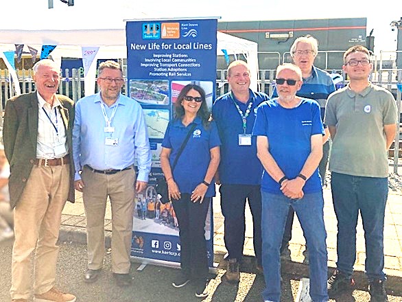 Jonathan Fryer (Volunteer), Steve White (Managing Director, South Eastern Railway), Therese Hammond (Kent CRP Project Officer), Gary Outram (Kent CRP Project Officer), Chris Anthony (Volunteer), Chris Fribbins (Volunteer) and Dominic Noades (Volunteer) pose for a photo at the Kent CRP promotional stall.