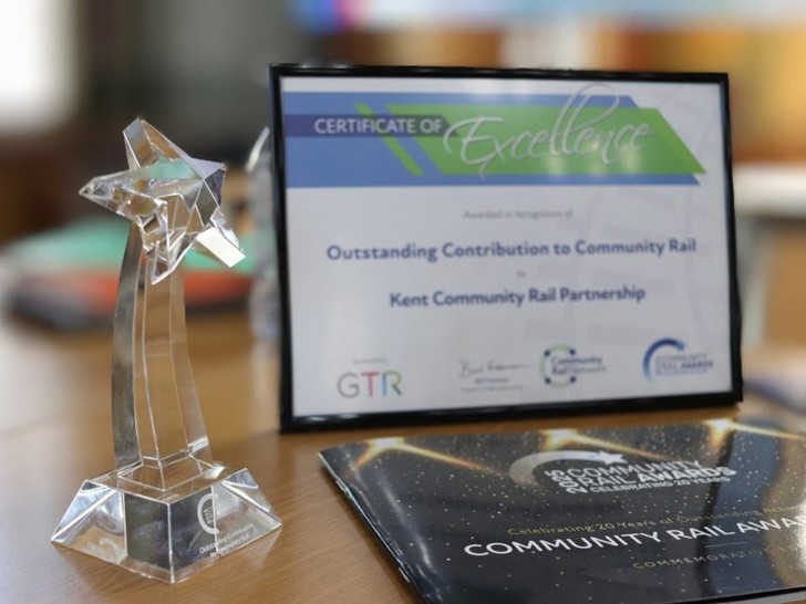An engraved perspex award and framed certificate "outstanding contribution to community rail - Kent Community Rail Partnership"