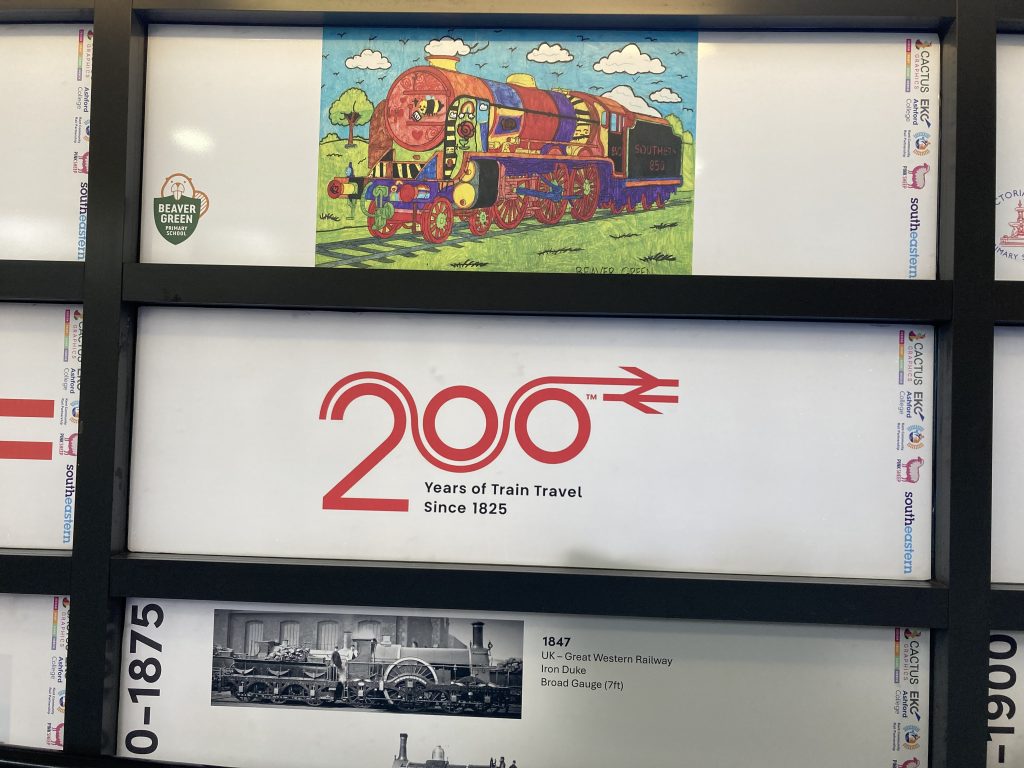 Decal panels depicting a colouring-in drawing of a steam loco, a Railway 200 logo and black and white images and technical info of the locomotives in use at Ashford 1850-1875