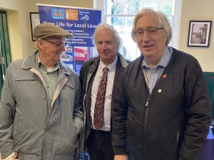 Mike, Clive and Chris stood in front of the Kent Community Rail Partnership promotional stand