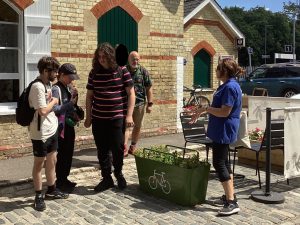 Students and tutors enjoy the sunshine outside Hollingbourne station