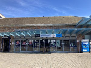 Forecourt and entrance to Bromley South station on a bright sunny day