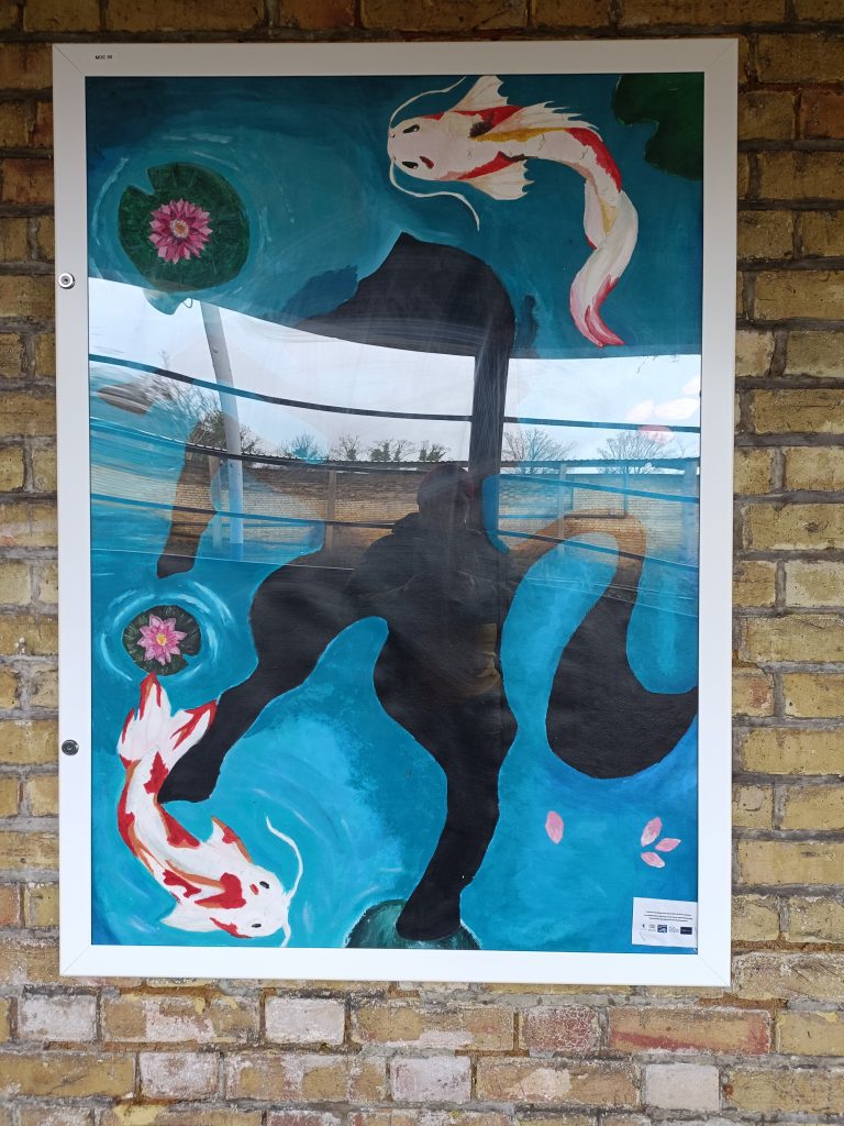 Student Artwork. Koi carp swimming in a pond with water lillies. The silhouette shape of a horse is beneath the pond's surface.