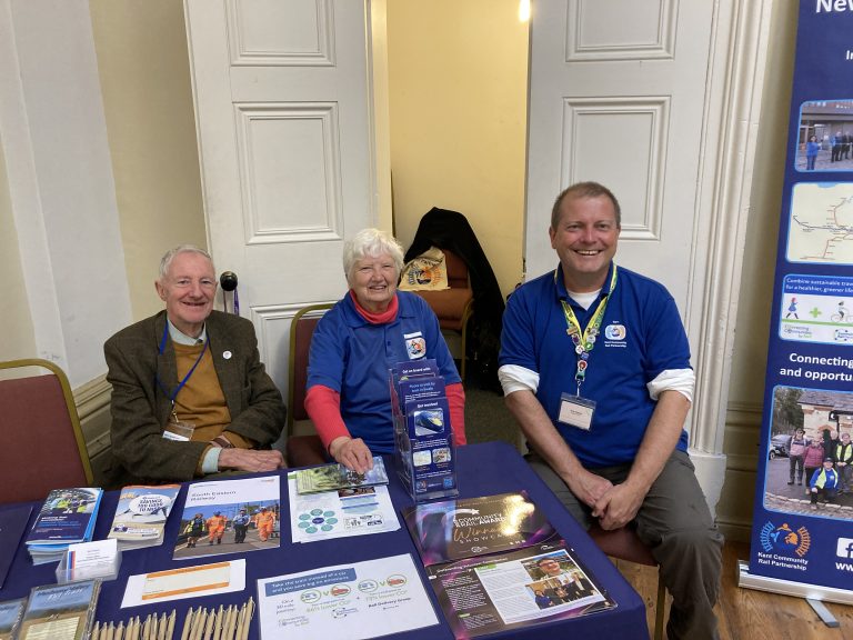 Jonathan Linda and Gary at our promotional stall, a variety of leaflets and brochures spread out on the table.