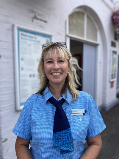 Mary Jane O'Brien in her Southeastern uniform, standing outside Queenborough station