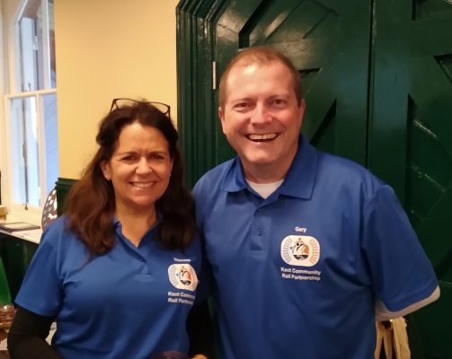Therese and Gary, Kent Community Rail Partnership Officers in blue polo shirts with Kent CRP logo.